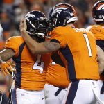 Denver Broncos running back Stevan Ridley (4) celebrates his touchdown against the Arizona Cardinals with quarterback Kyle Sloter (1) during the first half of an NFL preseason football game, Thursday, Aug. 31, 2017, in Denver. (AP Photo/Jack Dempsey)