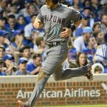 Arizona Diamondbacks' A.J. Pollock (11) scores during the third inning of a baseball game against the Chicago Cubs on Tuesday, Aug. 1, 2017, in Chicago. (AP Photo/Matt Marton)