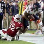 Chicago Bears running back Benny Cunningham (26) is knocked out of bounds by Arizona Cardinals linebacker Zaviar Gooden (52) during the first half of a preseason NFL football game, Saturday, Aug. 19, 2017, in Glendale, Ariz. (AP Photo/Ralph Freso)