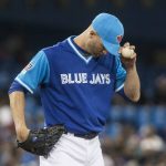 Toronto Blue Jays pitcher J.A. Happ pauses during the fifth inning of the team's baseball game against the Minnesota Twins on Friday, Aug. 25, 2017, in Toronto. (Chris Young/The Canadian Press via AP)