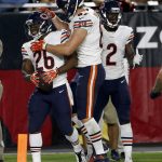 Chicago Bears running back Benny Cunningham (26) celebrates his touchdown with tight end Adam Shaheen (87) during the second half of a preseason NFL football game against the Arizona Cardinals, Saturday, Aug. 19, 2017, in Glendale, Ariz. (AP Photo/Ross D. Franklin)