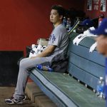 Los Angeles Dodgers' Kenta Maeda, of Japan, sits in the dugout after pitching the third inning of a baseball game against the Arizona Diamondbacks Thursday, Aug. 31, 2017, in Phoenix. (AP Photo/Ross D. Franklin)