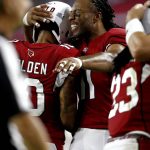 Arizona Cardinals wide receiver Larry Fitzgerald hugs teammate Brittan Golden (10) after Golden scored a touchdown against the Oakland Raiders during the first half of an NFL preseason football game, Saturday, Aug. 12, 2017, in Glendale, Ariz. (AP Photo/Ross D. Franklin)