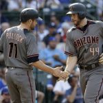 Arizona Diamondbacks' Paul Goldschmidt, right, celebrates with A.J. Pollock after hitting a two-run home run during the fifth inning of a baseball game against the Chicago Cubs, Thursday, Aug. 3, 2017, in Chicago. (AP Photo/Nam Y. Huh)