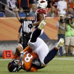 Denver Broncos tight end Steven Scheu (81) falls after making a touchdown catch against the Arizona Cardinals during the second half of an NFL preseason football game, Thursday, Aug. 31, 2017, in Denver. (AP Photo/Jack Dempsey)