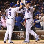 Chicago Cubs' Jon Lester, right, high-fives Ian Happ (8) after they score on his two-run home run during the third inning of an baseball game against the Arizona Diamondbacks on Tuesday, Aug. 1, 2017, in Chicago. (AP Photo/Matt Marton)