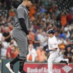 Arizona Diamondbacks starting pitcher Taijuan Walker, left, walks to the mound as Houston Astros designated hitter Carlos Beltran, back right, rounds the bases after hitting a solo home run during the second inning of a baseball game, Wednesday, Aug. 16, 2017, in Houston. (AP Photo/Eric Christian Smith)