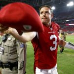 Arizona Cardinals quarterback Carson Palmer (3) tosses hit cap to fans after a preseason NFL football game against the Chicago Bears, Saturday, Aug. 19, 2017, in Glendale, Ariz. The Bears won 24-23. (AP Photo/Ross D. Franklin)