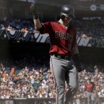 Arizona Diamondbacks' Chris Herrmann walks to the dugout after striking out against the San Francisco Giants during the ninth inning of a baseball game in San Francisco, Sunday, Aug. 6, 2017. The Giants won 6-3. (AP Photo/Jeff Chiu)