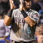 Arizona Diamondbacks' David Peralta (6) claps after scoring during the fifth inning of a baseball game against the Chicago Cubs on Tuesday, Aug. 1, 2017, in Chicago. (AP Photo/Matt Marton)