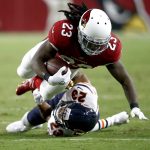 Arizona Cardinals running back Chris Johnson (23) is hit by Chicago Bears cornerback Kyle Fuller (23) during the first half of a preseason NFL football game, Saturday, Aug. 19, 2017, in Glendale, Ariz. (AP Photo/Ross D. Franklin)