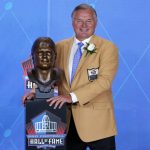 Former NFL placekicker Morten Andersen poses with his bust during inductions at the Pro Football Hall of Fame on Saturday, Aug. 5, 2017, in Canton, Ohio. (AP Photo/Gene J. Puskar)