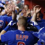 Chicago Cubs' Ian Happ, center, celebrates his home run against the Arizona Diamondbacks during the eighth inning of a baseball game Sunday, Aug 13, 2017, in Phoenix. (AP Photo/Ross D. Franklin)