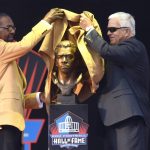 Kenny Easley, left, unveils his bust with his presenter. Tommy Rhodes. during inductions at the Pro Football Hall of Fame on Saturday, Aug.5, 2017, in Canton, Ohio. (AP Photo/David Richard)