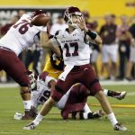 New Mexico State quarterback Tyler Rogers (17) throws a screen pass against Arizona State during the first half during an NCAA college football game, Thursday, Aug. 31, 2017, in Tempe, Ariz. (AP Photo/Rick Scuteri)