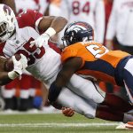 Arizona Cardinals defensive back Ryan Lewis (35) is hit by Denver Broncos inside linebacker Zaire Anderson during the first half of an NFL preseason football game, Thursday, Aug. 31, 2017, in Denver. (AP Photo/Jack Dempsey)