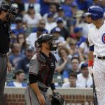 Chicago Cubs' Willson Contreras, right, talks to home plate umpire Pat Hoberg, left, as Arizona Diamondbacks catcher Jeff Mathis looks to the field during the fourth inning of a baseball game Thursday, Aug. 3, 2017, in Chicago. (AP Photo/Nam Y. Huh)