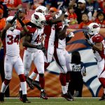From left; Arizona Cardinals free safety Harlan Miller (34), linebacker Cap Capi (42), free safety Harlan Miller linebacker Alex Bazzie (54) and cornerback Jarell Carter (39) celebrate a safety caused by Alex Bazzie against the Denver Broncos during the first half of an NFL preseason football game, Thursday, Aug. 31, 2017, in Denver. (AP Photo/David Zalubowski)