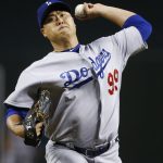 Los Angeles Dodgers' Hyun-Jin Ryu, of South Korea, throws a pitch to the Arizona Diamondbacks during the first inning of a baseball game Wednesday, Aug. 30, 2017, in Phoenix. (AP Photo/Ross D. Franklin)