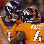 Denver Broncos running back Stevan Ridley (4) celebrates his touchdown against the Arizona Cardinals with quarterback Kyle Sloter (1) during the first half of an NFL preseason football game, Thursday, Aug. 31, 2017, in Denver. (AP Photo/David Zalubowski)