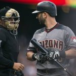 Arizona Diamondbacks' Daniel Descalso (3) questions home plate umpire Quinn Wolcott after he was called out on strikes during the first inning of the team's baseball game against the San Francisco Giants on Saturday, Aug. 5, 2017, in San Francisco. (AP Photo/D. Ross Cameron)