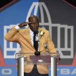 Former NFL player Terrell Davis salutes as he delivers his speech during an induction ceremony at the Pro Football Hall of Fame, Saturday, Aug. 5, 2017, in Canton, Ohio. (AP Photo/David Richard)
