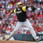 Pittsburgh Pirates starting pitcher Ivan Nova throws during the first inning of a baseball game against the Cincinnati Reds, Friday, Aug. 25, 2017, in Cincinnati. (AP Photo/John Minchillo)