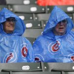 Baseball fans wait out a rain delay during the second inning in a baseball game between the Arizona Diamondbacks and the Chicago Cubs, Thursday, Aug. 3, 2017, in Chicago. (AP Photo/Nam Y. Huh)