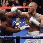 Conor McGregor, right, fights Floyd Mayweather Jr. in a super welterweight boxing match Saturday, Aug. 26, 2017, in Las Vegas. (AP Photo/Eric Jamison)