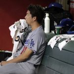 Los Angeles Dodgers starting pitcher Kenta Maeda (18) sits in the dugout during the fourth inning of a baseball game against the Arizona Diamondbacks, Tuesday, Aug. 8, 2017, in Phoenix. (AP Photo/Matt York)