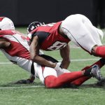 Atlanta Falcons wide receiver Taylor Gabriel (18) hits Arizona Cardinals cornerback Patrick Peterson (21) after Peterson intercepted the ball briefly but lost control during the first half of an NFL football game, Saturday, Aug. 26, 2017, in Atlanta. No interception was made. (AP Photo/David Goldman)