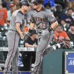 Arizona Diamondbacks' Jake Lamb (22) is congratulated by third base coach Tony Perezchica after hitting a his solo home run off Houston Astros starting pitcher Mike Fiers in the sixth inning of a baseball game, Thursday, Aug. 17, 2017, in Houston. (AP Photo/Eric Christian Smith)