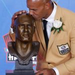 Jason Taylor kisses a bust of him during inductions at the Pro Football Hall of Fame on Saturday, Aug. 5, 2017, in Canton, Ohio. (AP Photo/Gene J. Puskar)