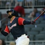 Atlanta Braves' Matt Kemp watches the flight of a two-run home run during the first inning of a baseball game against the Colorado Rockies on Friday, Aug. 25, 2017, in Atlanta. (AP Photo/John Bazemore)