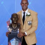 Jason Taylor poses with his bust, during his induction at the Pro Football Hall of Fame on Saturday, Aug. 5, 2017, in Canton, Ohio. (AP Photo/Gene J. Puskar)