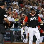 Arizona Diamondbacks' David Peralta, right, argues with umpire Ron Kulpa, left, after being thrown  out of a baseball game during the fifth inning against the San Francisco Giants, Sunday, Aug. 27, 2017, in Phoenix. (AP Photo/Ross D. Franklin)