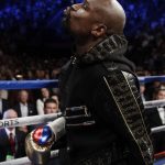 Floyd Mayweather Jr. enters the ring before a super welterweight boxing match against Conor McGregor, Saturday, Aug. 26, 2017, in Las Vegas. (AP Photo/Isaac Brekken)