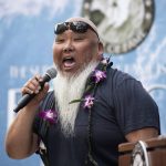 Pastor Sumo Sato helps host the induction ceremony for the Surfers' Hall of Fame in Huntington Beach, Calif., Friday, Aug. 4, 2017.  (Nick Agro/The Orange County Register via AP)
