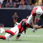 Arizona Cardinals wide receiver Jaron Brown (13) jumps over Atlanta Falcons cornerback Deji Olatoye (30) during the first half of an NFL football game, Saturday, Aug. 26, 2017, in Atlanta. (AP Photo/David Goldman)