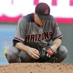 Arizona Diamondbacks pitcher Zack Greinke pauses for a few moments before the bottom of the fourth inning of the team's baseball game against the Minnesota Twins on Saturday, Aug. 19, 2017, in Minneapolis. (AP Photo/Jim Mone)