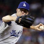 Los Angeles Dodgers starting pitcher Alex Wood throws against the Arizona Diamondbacks during the first inning of a baseball game, Wednesday, Aug. 9, 2017, in Phoenix. (AP Photo/Matt York)