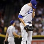 Los Angeles Dodgers starting pitcher Alex Wood looks down after giving up a run to the Arizona Diamondbacks during the sixth inning of a baseball game, Wednesday, Aug. 9, 2017, in Phoenix. (AP Photo/Matt York)