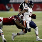 Chicago Bears running back Ka'Deem Carey (25) is tackled by Arizona Cardinals defensive tackle Robert Nkemdiche during the first half of a preseason NFL football game, Saturday, Aug. 19, 2017, in Glendale, Ariz. (AP Photo/Ross D. Franklin)
