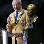 Dallas Cowboys owner Jerry Jones speaks next to his bust during inductions at the Pro Football Hall of Fame on Saturday, Aug. 5, 2017, in Canton, Ohio. (AP Photo/Gene J. Puskar)