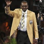 Kenny Easley waves to the crowd after receiving his gold jacket during the Pro Football Hall of Fame dinner at Canton Memorial Civic Center in Canton, Ohio, Friday, Aug. 4, 2017. (Scott Heckel/The Canton Repository via AP)