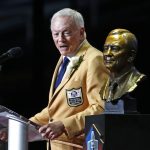 Dallas Cowboys owner Jerry Jones speaks next to a bust of him during inductions at the Pro Football Hall of Fame on Saturday, Aug. 5, 2017, in Canton, Ohio. (AP Photo/Gene J. Puskar)