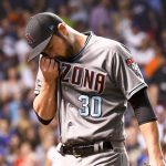 Arizona Diamondbacks relief pitcher David Hernandez (30) wipes his face after being relieved during the sixth inning of a baseball game against the Chicago Cubs on Tuesday, Aug. 1, 2017, in Chicago. Reliever Hernandez and infielder Adam Rosales joined the Diamondbacks after they were acquired in a pair of trades. It's a reunion for Hernandez, who played for the Diamondbacks for four seasons before he signed with Philadelphia as a free agent in December 2015. (AP Photo/Matt Marton)
