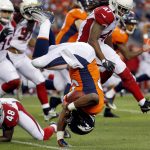 Denver Broncos running back De'Angelo Henderson (33) is up-ended by Arizona Cardinals defensive back Gump Hayes (48) during the first half of an NFL preseason football game, Thursday, Aug. 31, 2017, in Denver. (AP Photo/Jack Dempsey)