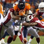 Denver Broncos running back Juwan Thompson (40) is hit by Arizona Cardinals linebacker Zaviar Gooden, right, and defensive end Peli Anau, left, during the second half of an NFL preseason football game, Thursday, Aug. 31, 2017, in Denver. (AP Photo/Jack Dempsey)