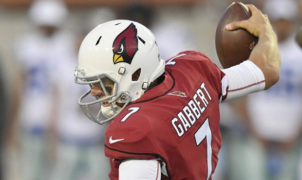 Arizona Cardinals quarterback Blaine Gabbert loses his balance while being sacked during the first ...